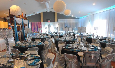A formal wedding reception set in the Stage North hall